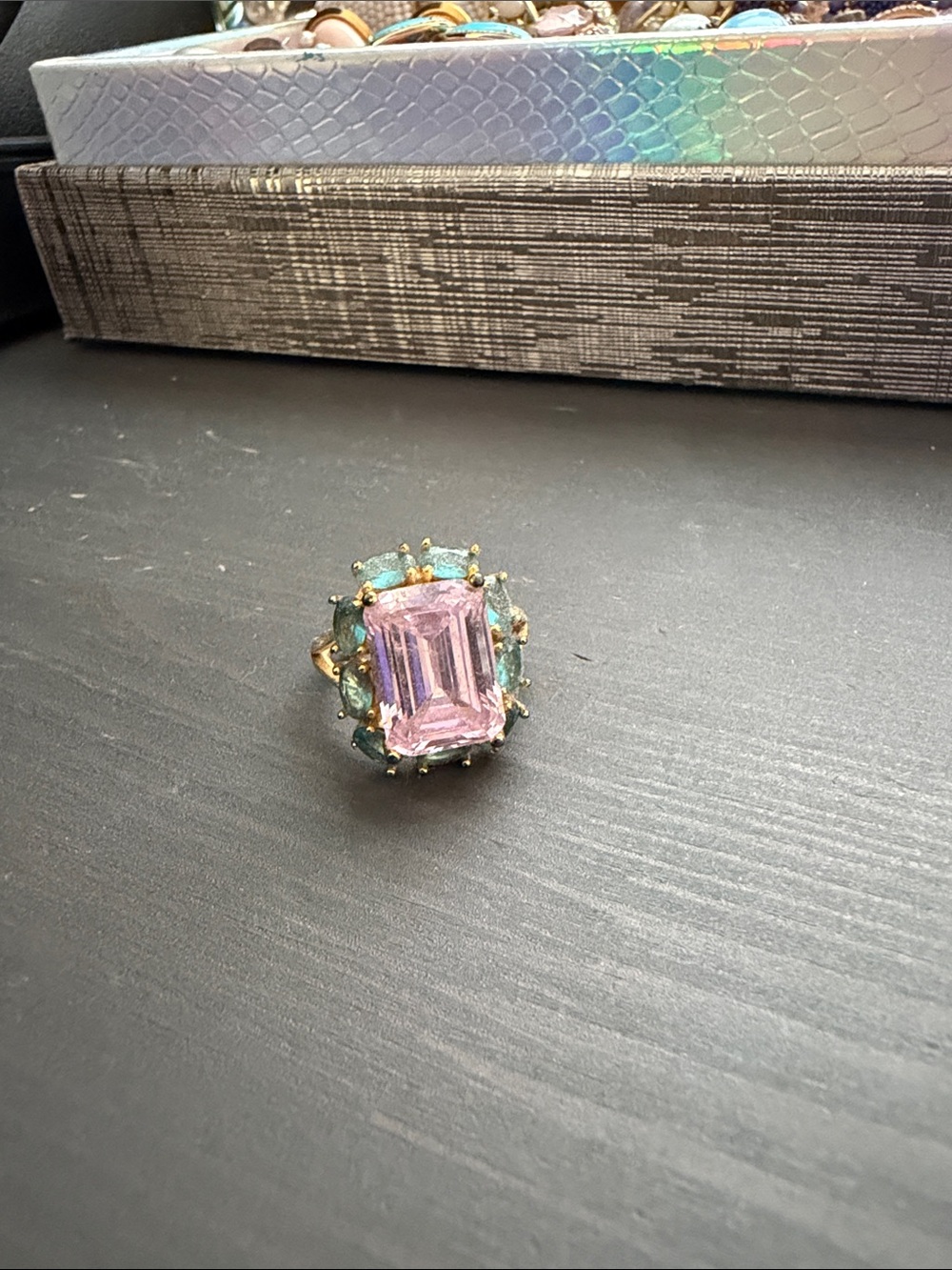 Gold Ring with Pink Emerald-Cut Center and Green Accent Stones